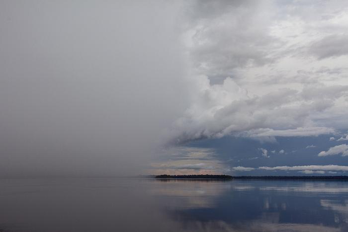 Storm brewing over the Rio Negro, Amazon, Brazil by Carolyn Monastra